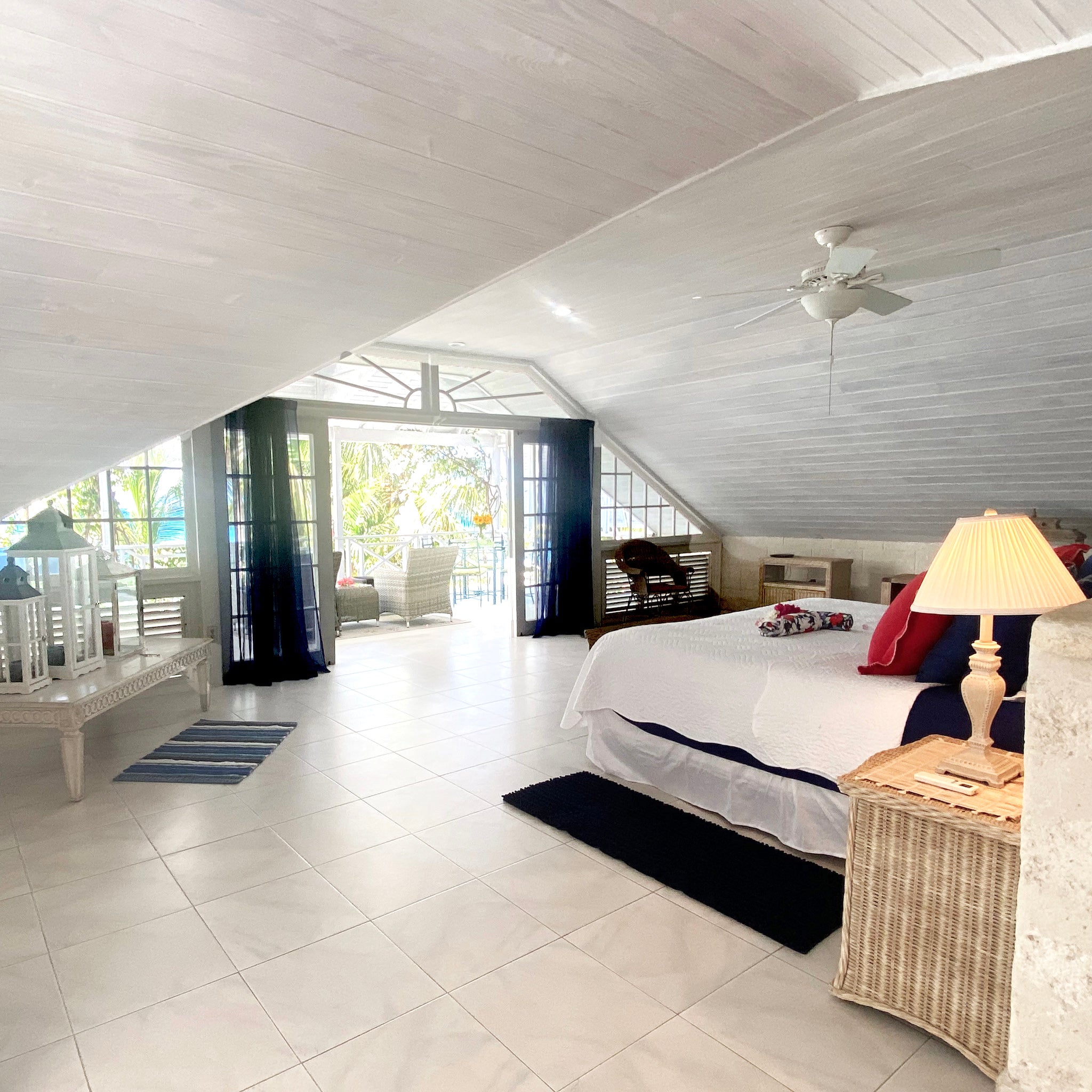 The primary bedroom at Tantalus Villa on Barbados West Coast has views overlooking the most beautiful beach with a large private terrace.