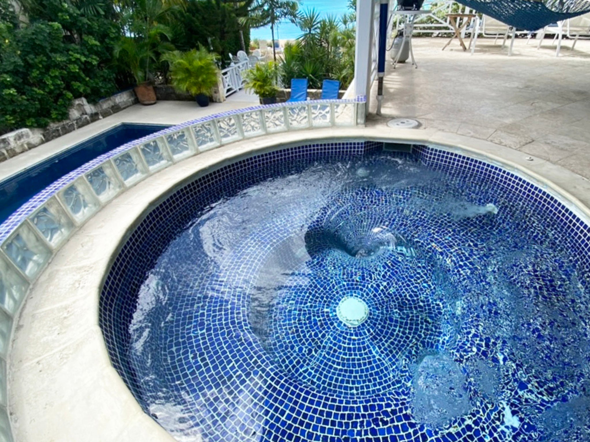 Tantalus Villa's hot tub, overlooking the pool and the Brighton Beach in Barbados.